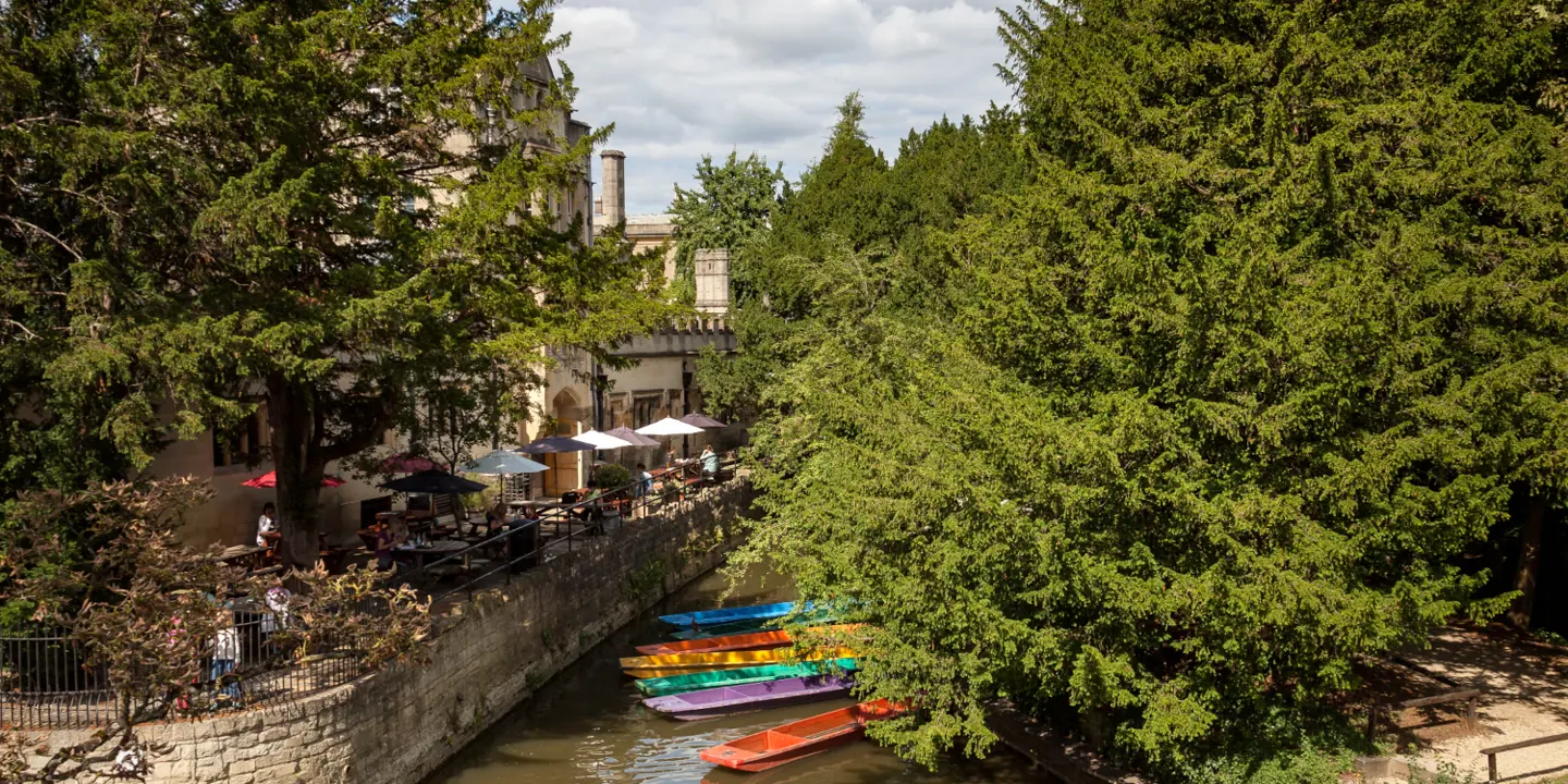 Vibrant assortment of boats sailing along a picturesque river.