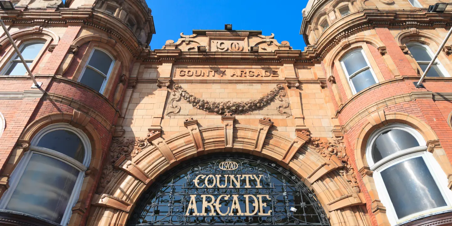 County Arcade: A prominent building featuring a sign displaying its name.