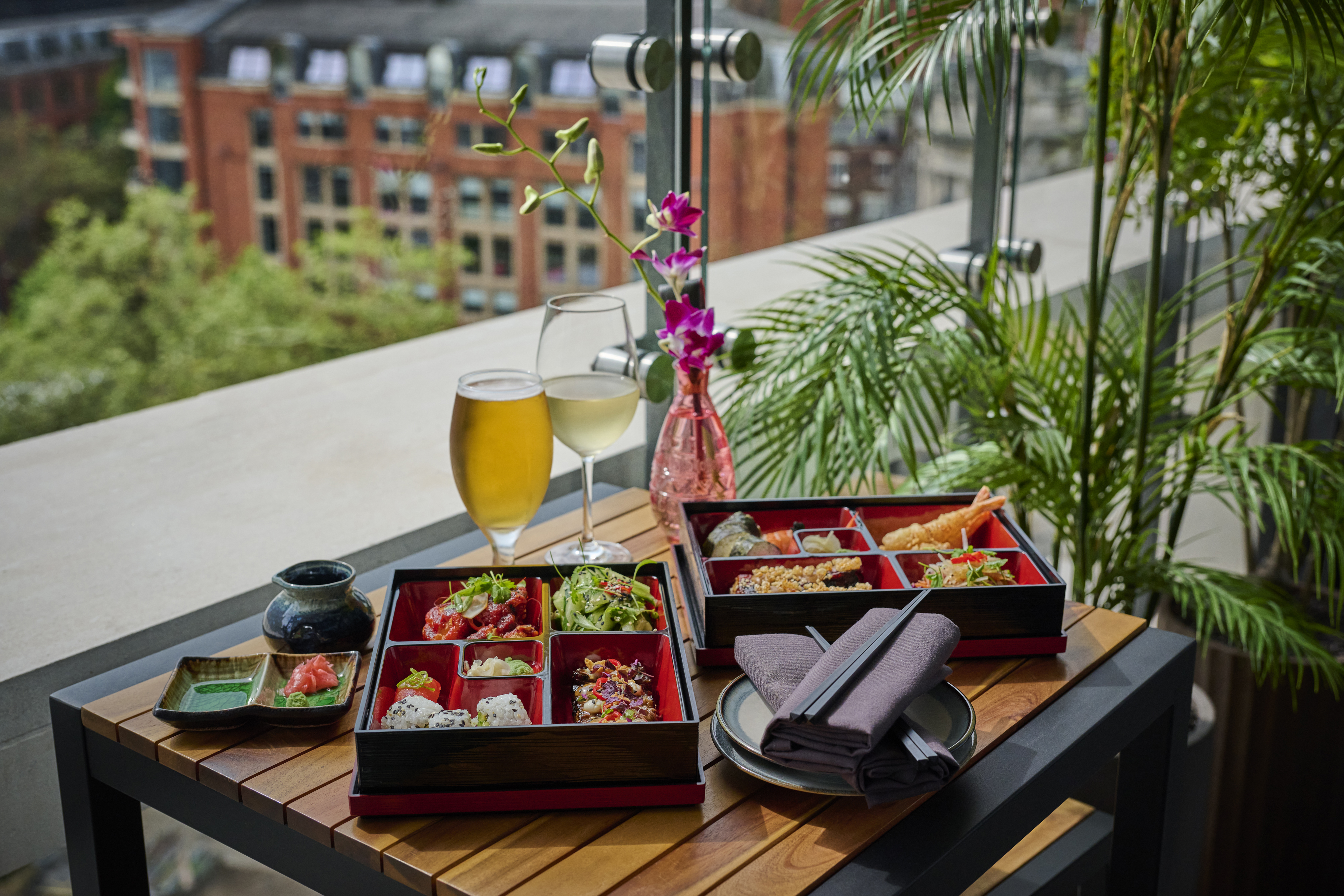 two drinks and boxes of food available at Sora