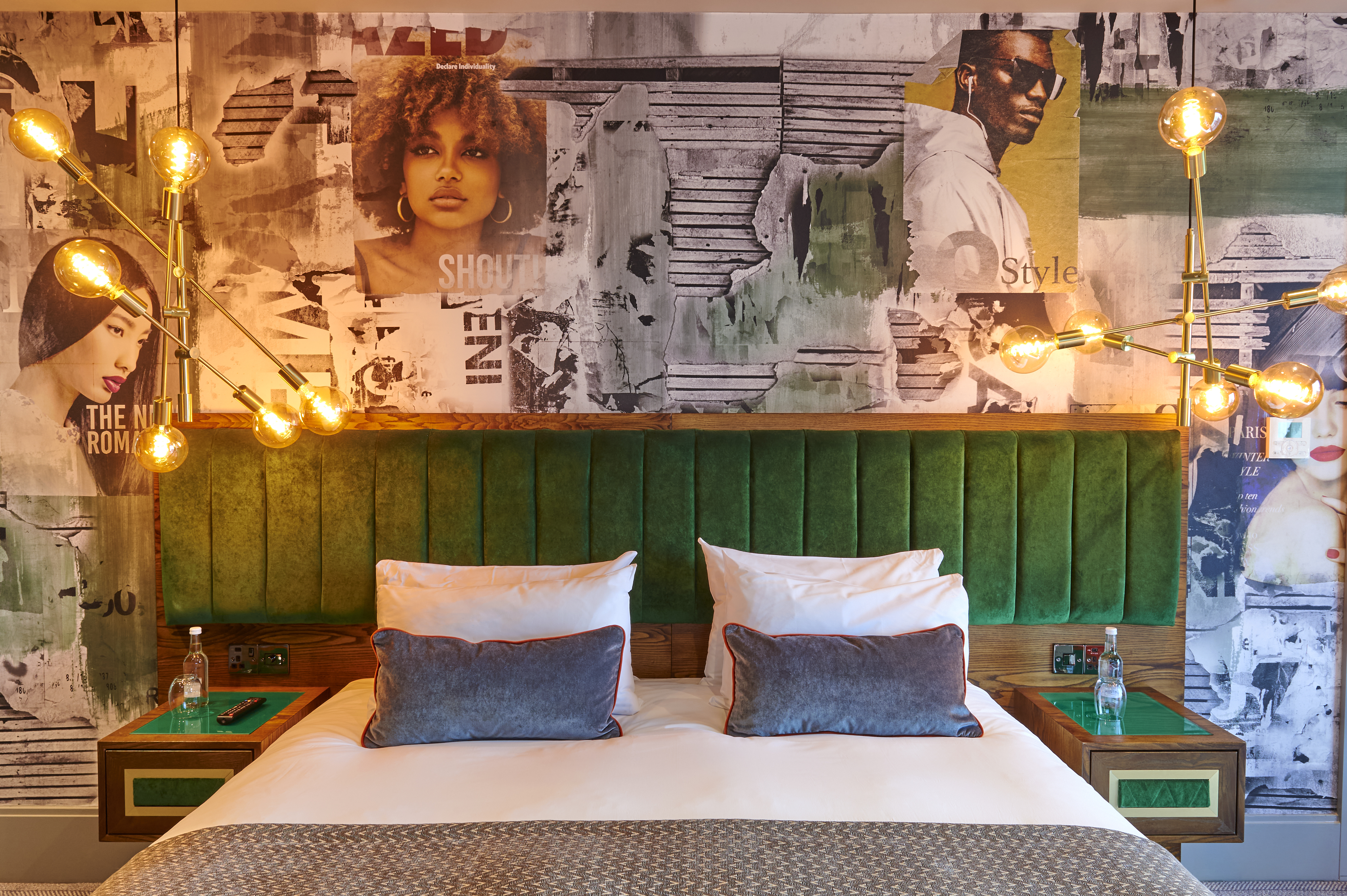 A well-furnished bedroom featuring a comfortable bed and two stylish lamps.