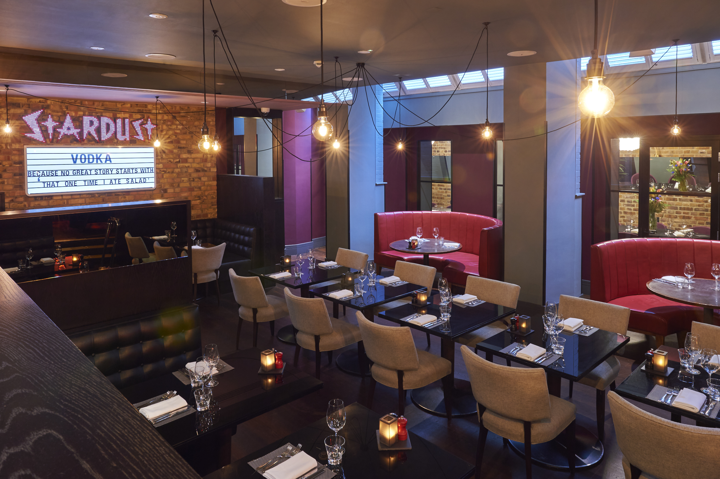 A spacious dining room filled with numerous tables and chairs.