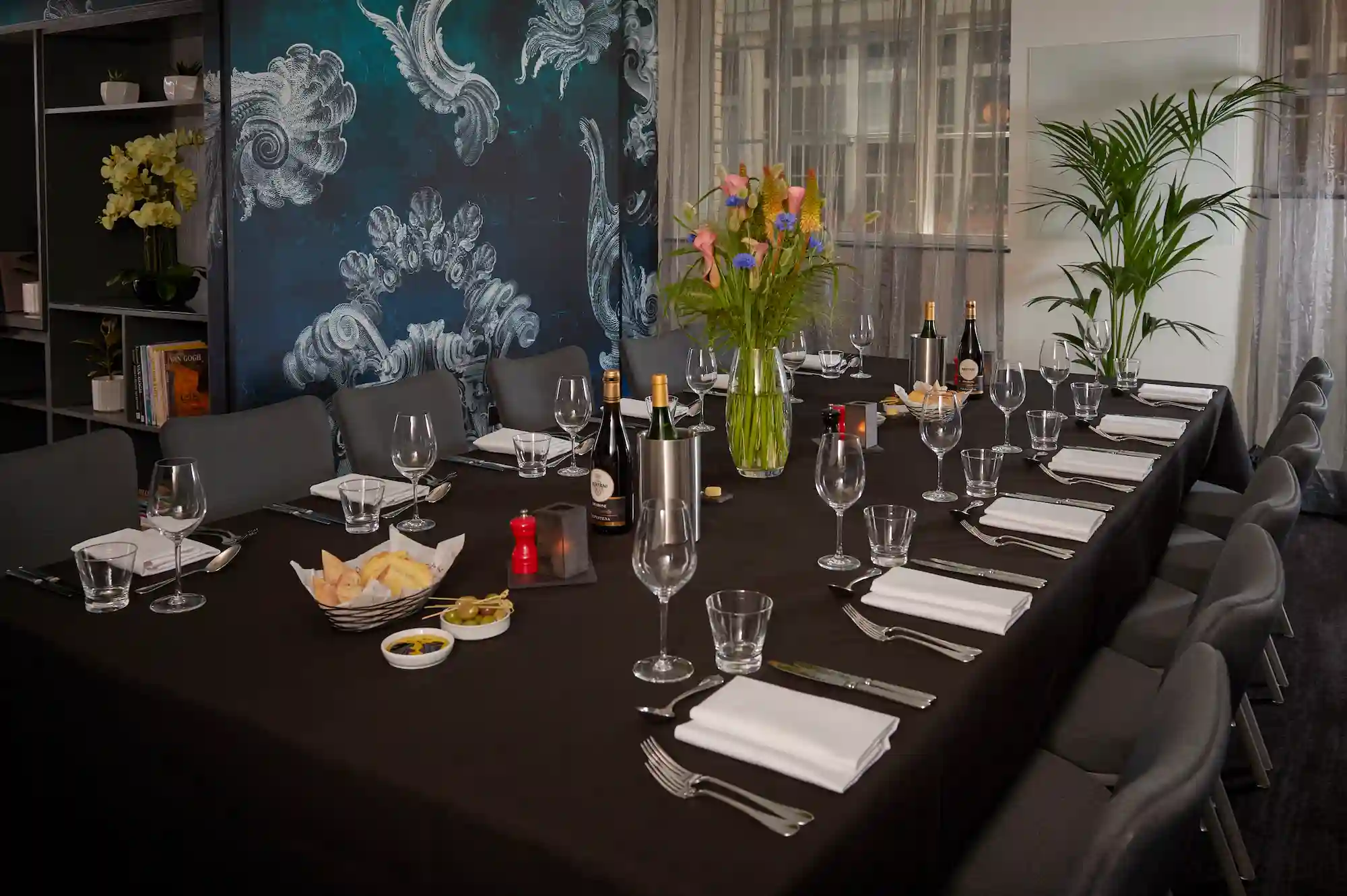 A table arranged with neatly set place settings.