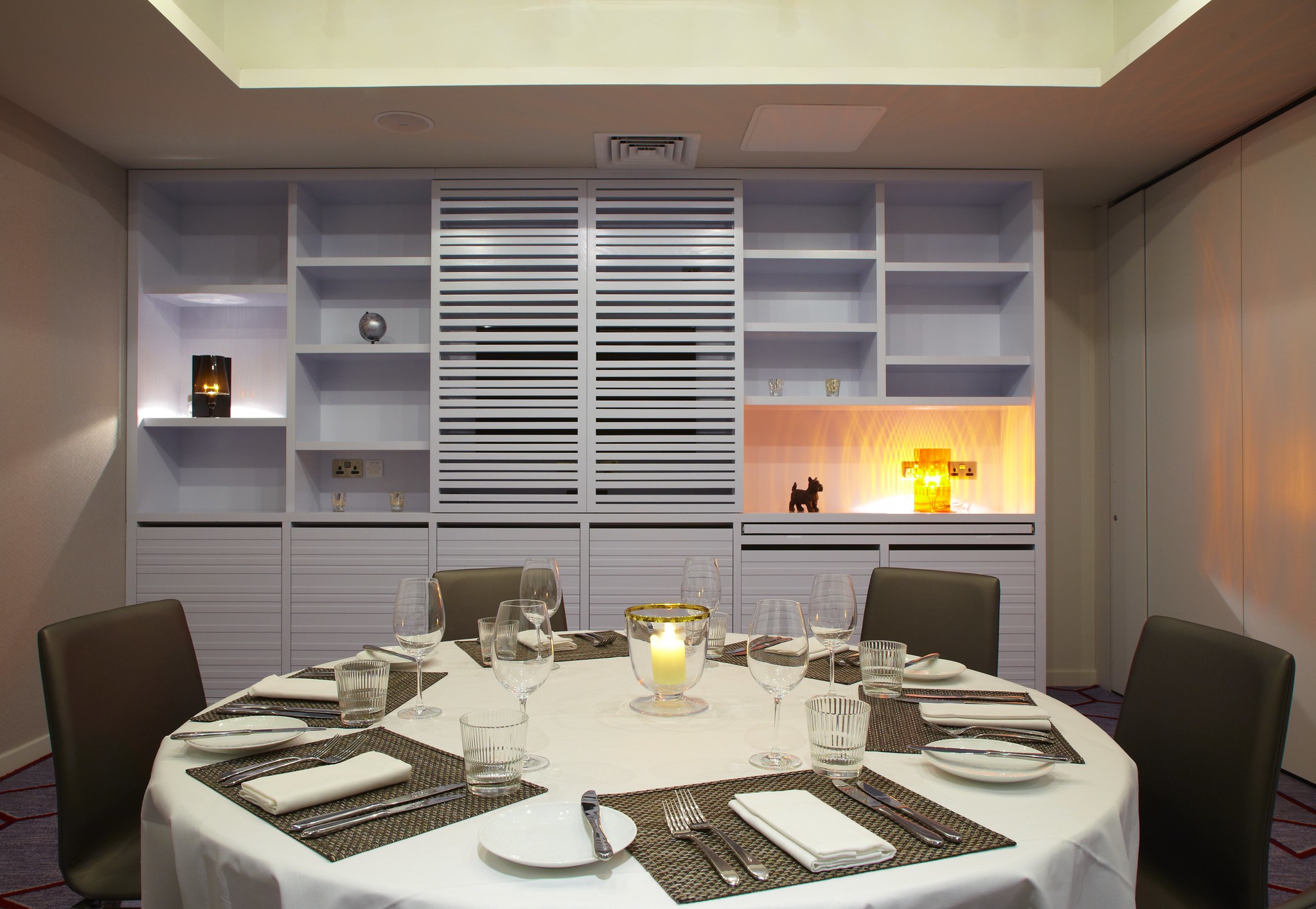 A table set with elegant place settings and cutlery.