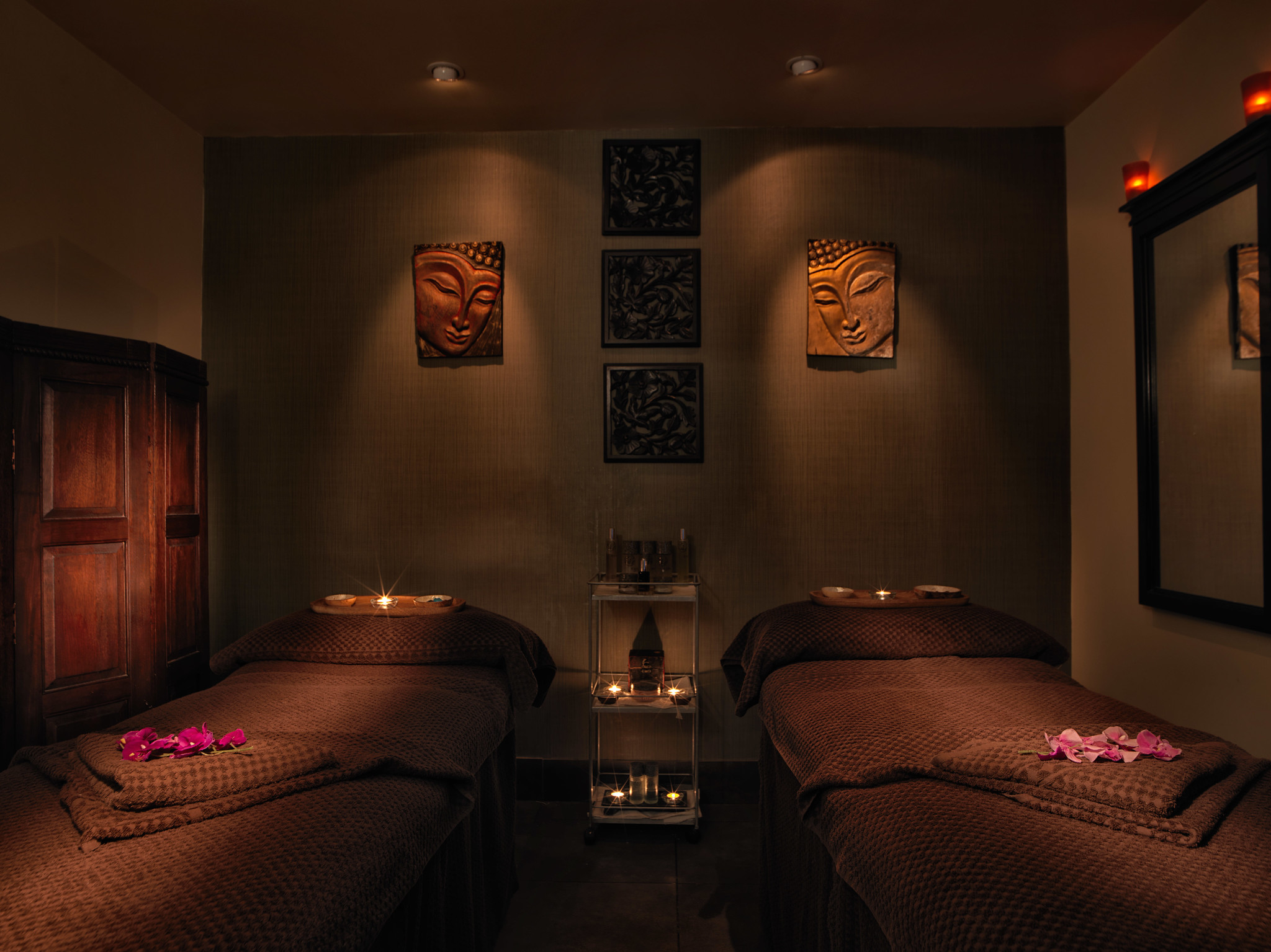 Two beds positioned in a room.