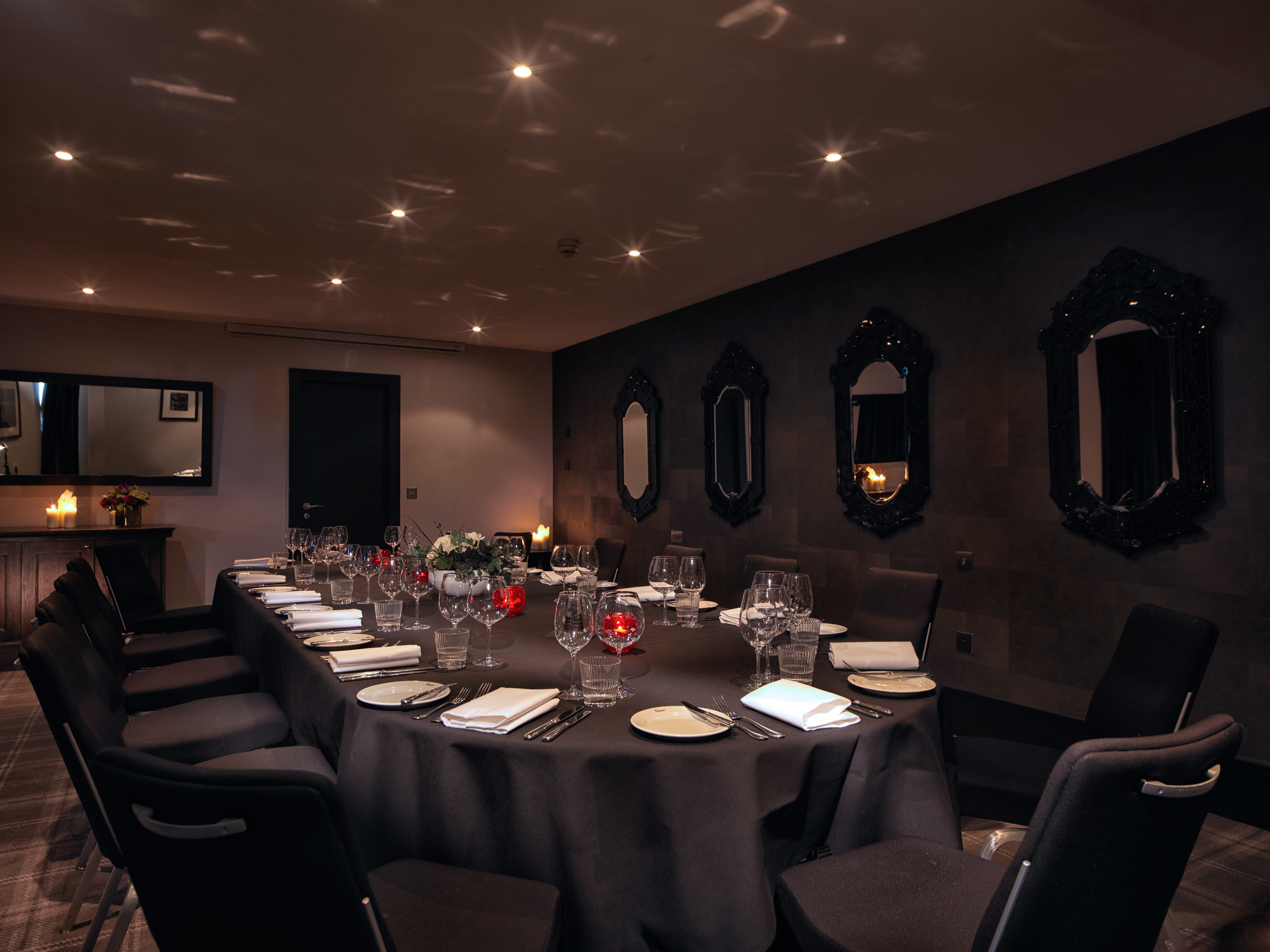 Rubislaw private dining room with atmospheric lighting showcasing a beautifully set table for a formal dinner.